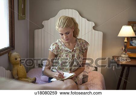 Girl writing diary View Large Photo Image Stock Photo - Girl writing diary. Fotosearch
