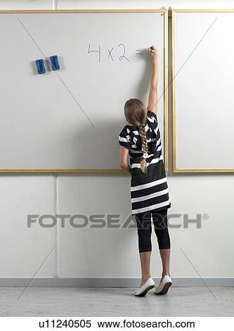 Girl writing on whiteboard View Large Photo Image Stock Photography - Girl writing on whiteboard. Fotosearch
