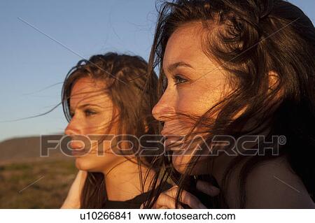 Stock Image - Girls looking to the side. Fotosearch