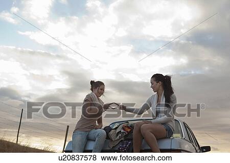 Girls playing on boot View Large Photo Image Stock Photo - Girls playing on boot. Fotosearch