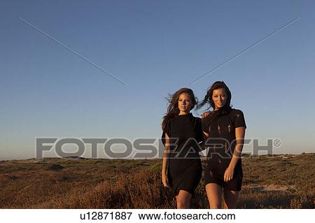 Girls walking View Large Photo Image Stock Photo - Girls walking. Fotosearch