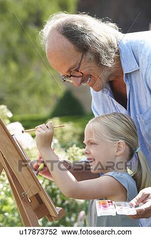 Grandfather and granddaughter painting View Large Photo Image Stock Image - Grandfather and granddaughter painting. Fotosearch