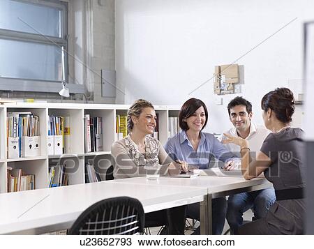 Stock Image - Group meeting in Architect office. Fotosearch