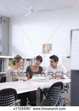 Stock Photo - Group meeting in Architect office. Fotosearch