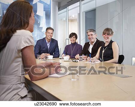 Group Meeting in boardroom View Large Photo Image Stock Image - Group Meeting in boardroom. Fotosearch