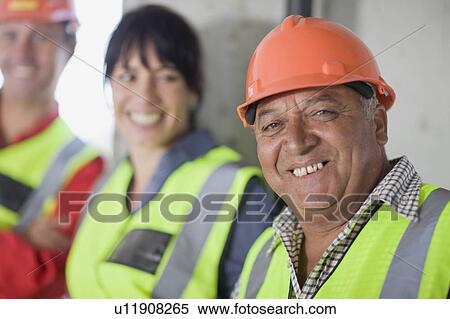 Stock Photography - Group of smiling workers. Fotosearch