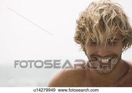 Guy looking down, smiling View Large Photo Image Stock Photo - Guy looking down, smiling. Fotosearch