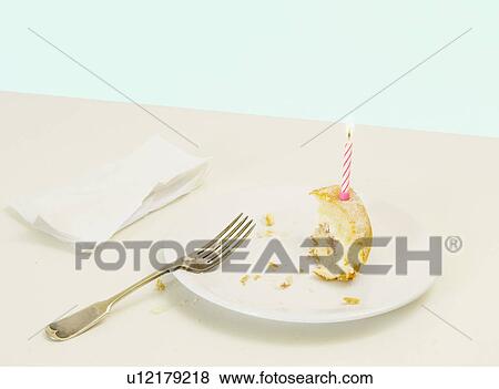 half eaten birthday cake with candle View Large Photo Image Stock Photo - half eaten birthday cake with candle. Fotosearch
