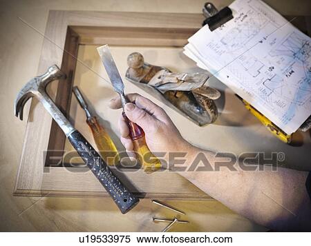 Hand holding woodworking tools View Large Photo Image Stock Photography - Hand holding woodworking tools. Fotosearch