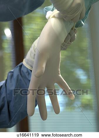 Stock Photo - Hand with surgical gloves. Fotosearch