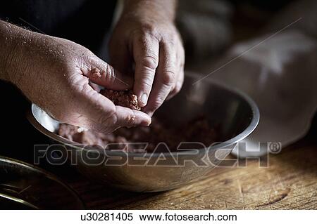 Stock Photography - Hands forming meatball. Fotosearch