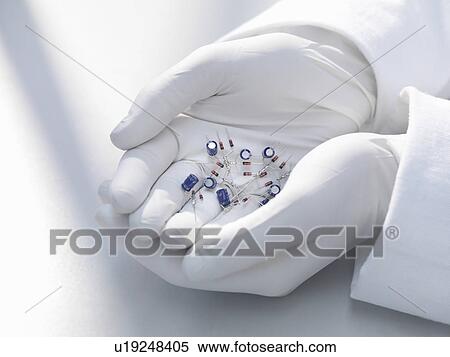 Hands holding electronic parts View Large Photo Image Stock Photography - Hands holding electronic parts. Fotosearch