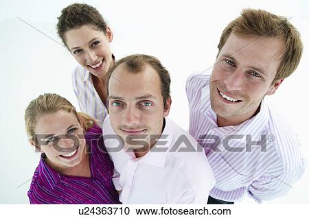 Stock Image - Happy business team look to camera. Fotosearch