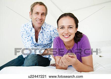 Stock Image - Happy couple at home. Fotosearch