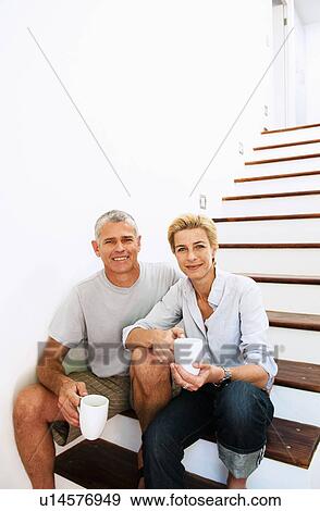 Stock Photo - Happy couple at home. Fotosearch