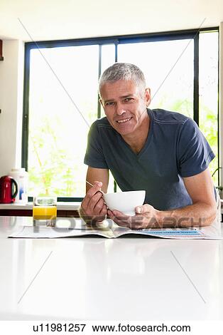 Happy man at breakfast View Large Photo Image Stock Photo - Happy man at breakfast. Fotosearch