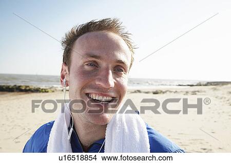 Happy man on beach after exercise View Large Photo Image Picture - Happy man on beach after exercise. Fotosearch