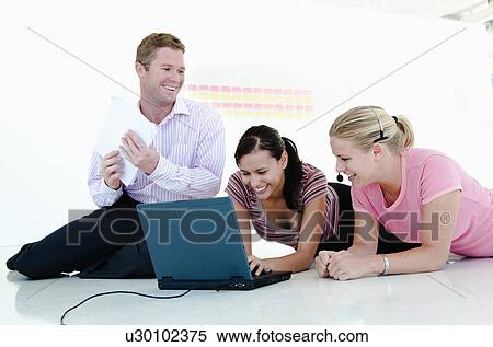 Stock Photography - Happy relaxed business team. Fotosearch