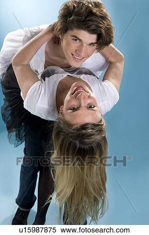 Happy young couple bend together embrac View Large Photo Image Stock Photography - Happy young couple bend together embrac. Fotosearch