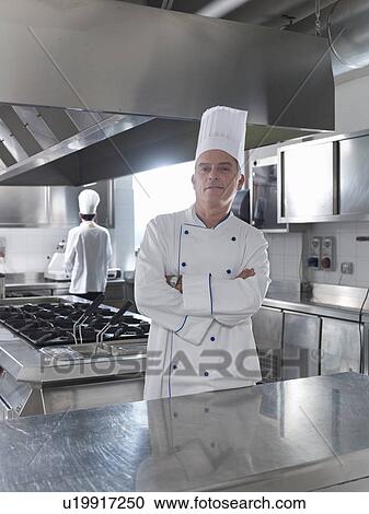 Stock Image - Head Chef in restaurant kitchen. Fotosearch