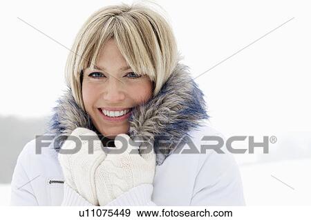 Head shot of woman in the snow View Large Photo Image Stock Photo - Head shot of woman in the snow. Fotosearch