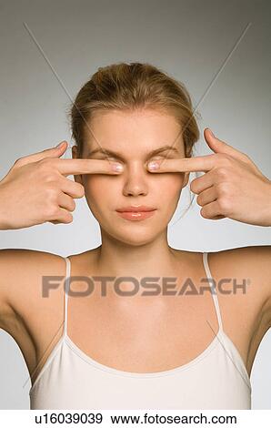 Healthy female covering eyes View Large Photo Image Stock Photo - Healthy female covering eyes. Fotosearch