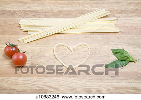 Heart shape and pasta, tomatoes, basil View Large Photo Image Stock Photograph - Heart shape and pasta, tomatoes, basil. Fotosearch