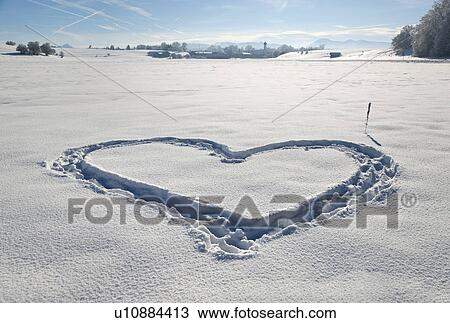 Heart shape in pristine snow View Large Photo Image Stock Image - Heart shape in pristine snow. Fotosearch