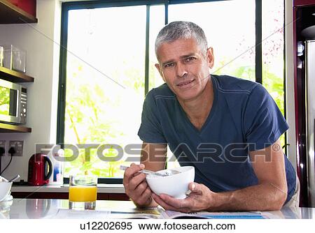 Home owner at breakfast View Large Photo Image Stock Photography - Home owner at breakfast. Fotosearch