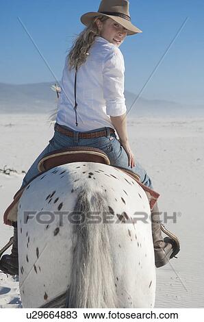 Horseriding in the sand View Large Photo Image Stock Image - Horseriding in the sand. Fotosearch