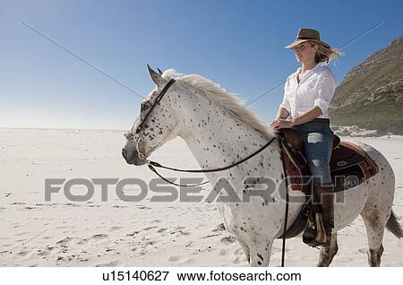 Horseriding on the beach View Large Photo Image Stock Photo - Horseriding on the beach. Fotosearch