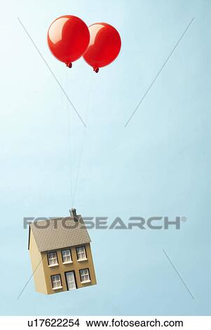 Picture - House floating away with two balloons. Fotosearch