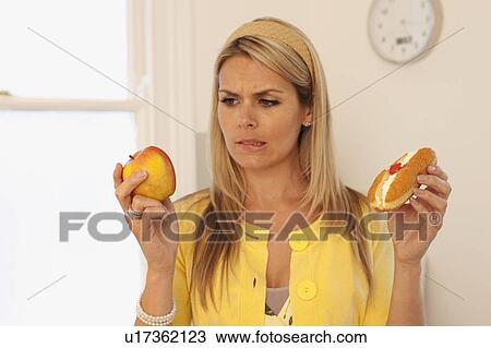 Indecisive young woman View Large Photo Image Stock Image - Indecisive young woman. Fotosearch