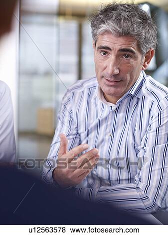 Individuals in a group meeting View Large Photo Image Stock Photo - Individuals in a group meeting. Fotosearch