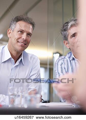 Stock Photo - Individuals in a group meeting. Fotosearch