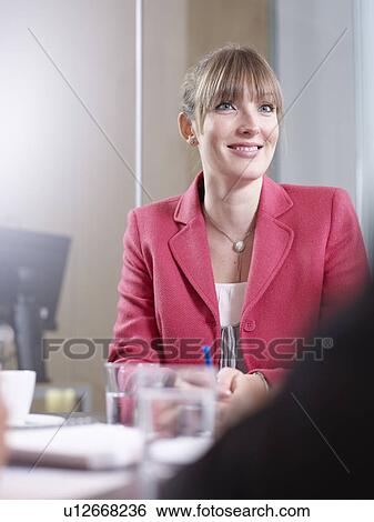 Stock Photograph - Individuals in a group meeting. Fotosearch