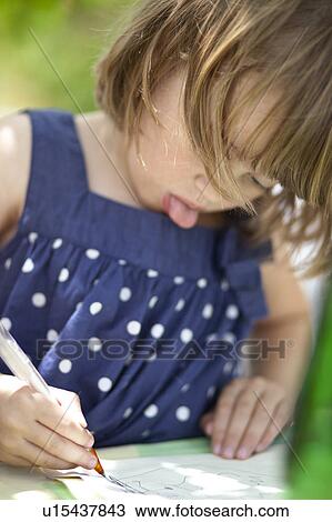 Stock Image - Kid drawing. Fotosearch
