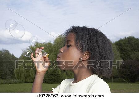 Stock Image - Kids in Garden. Fotosearch