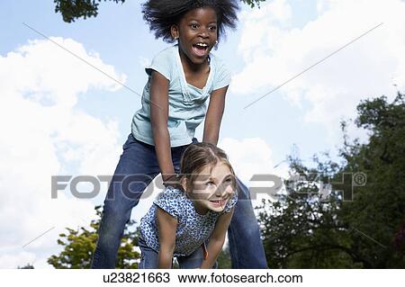 Stock Image - Kids in Garden. Fotosearch