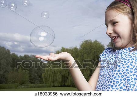 Stock Photograph - Kids in Garden. Fotosearch