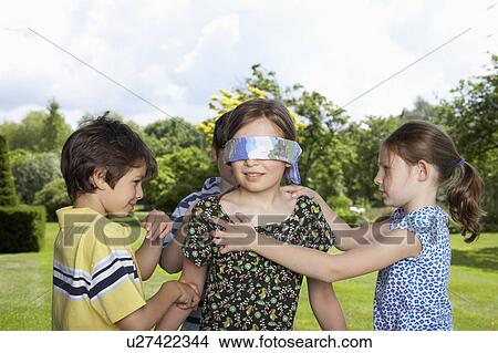Kids playing in garden View Large Photo Image Picture - Kids playing in garden. Fotosearch