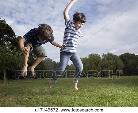 Kids playing in garden View Large Photo Image Stock Image - Kids playing in garden. Fotosearch