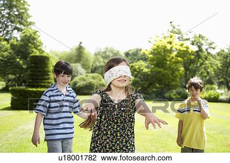 Kids playing in garden View Large Photo Image Stock Image - Kids playing in garden. Fotosearch