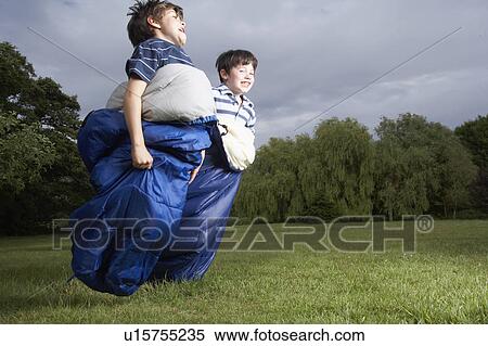 Kids playing in garden View Large Photo Image Stock Photography - Kids playing in garden. Fotosearch