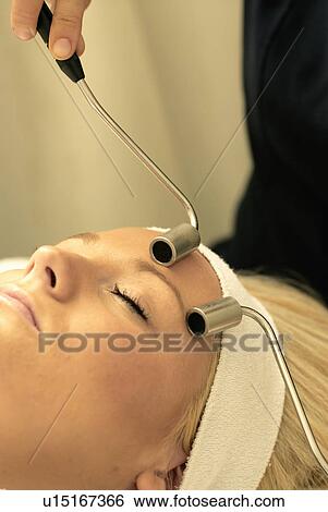 Lady having face massage View Large Photo Image Stock Photograph - Lady having face massage. Fotosearch