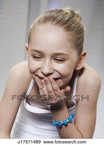 Laughing girl washing her face View Large Photo Image Stock Photo - Laughing girl washing her face. Fotosearch