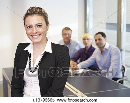 Stock Photography - Leading Busines Woman in meeting. Fotosearch