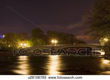 Lit bridge over river at night View Large Photo Image Stock Image - Lit bridge over river at night. Fotosearch