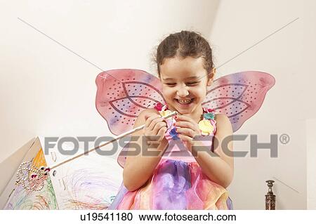 Stock Image - Little girl with fairy costume. Fotosearch