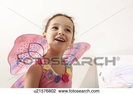 Stock Image - Little girl with fairy costume. Fotosearch